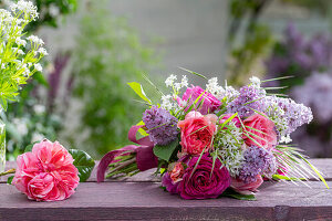 Bouquet of lilac (Syringa Vulgaris), rose (Rosa) 'Fräulein Maria', rose Chippendale, wild garlic flowers and woodruff