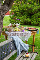 Cake buffet in the garden under the fruit tree