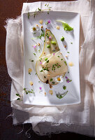 Pear carpaccio with cheese, herbs, daisies and honey