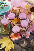 Muffin tins on glasses to protect against insects and leaves