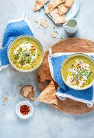 Pea and broccoli soup with croutons and chilli oil