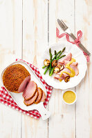Roasted spiced ham with asparagus and mushrooms