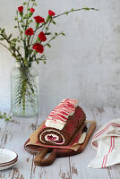 Chocolate sponge roll with cherry cream cheese filling