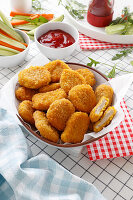Crispy chicken nuggets with ketchup