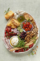 Antipasti platter with burrata and various garnishes