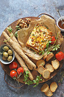 Baked feta with tomatoes and pine nuts