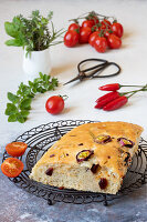 Focaccia with sun-dried tomatoes, thyme, oregano and spring onions