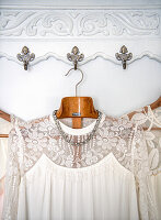 Lace dresses on decorative vintage-style hooks