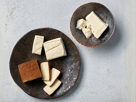 Different types of tofu on ceramic plates
