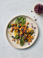 Grilled romaine lettuce with blueberries and tempeh crumble