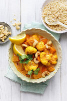 Cauliflower and pumpkin curry with cashew nuts and rice