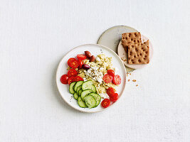 Greek scrambled eggs with tomatoes and cucumber