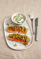 Salmon fillet with herb crust and cucumber salad