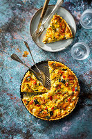 Courgette quiche with onions and red peppers