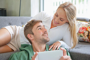 Couple on Sofa Using Smartphone