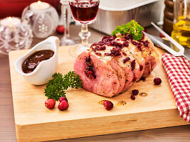 Stuffed pork roulade with cranberry sauce