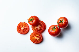 Whole and sliced tomatoes