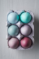 Colourful Easter eggs in egg carton