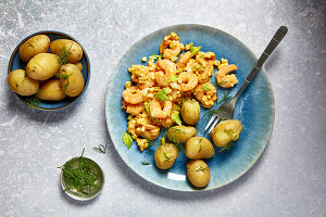 Scrambled eggs with prawns and jacket potatoes