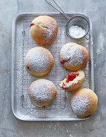 Berliner with strawberry filling and powdered sugar