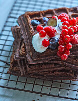 Chocolate waffles with berries and cream