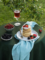 Pancakes with berries and powdered sugar