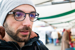 Tilburg, Netherlands. Syrian former refugee visiting the weekly saturday market purchasing his daily groceries.