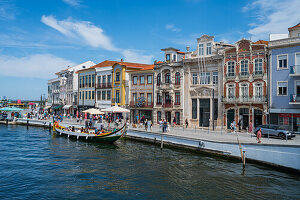 Boat ride through canals in a colorful and traditional Moliceiro boat, Aveiro, Portugal