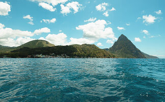 Turquoise water and green hills