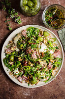 Salad with artichokes, mozzarella, farro and olives