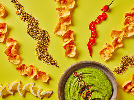 Hummus dip with crisps, lentils and lemon