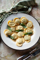 Ricotta and spinach ravioli with sage leaves