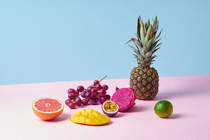 Composition of tropical fruits with pineapple, dragon fruit, grapefruit, passion fruit, lime, mango