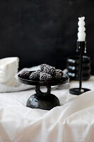 Blackberries on a black plate