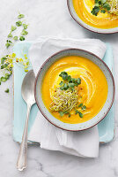 Carrot soup with sprouts