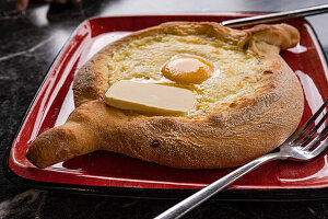 Adjarian-style khachapuri with egg and butter