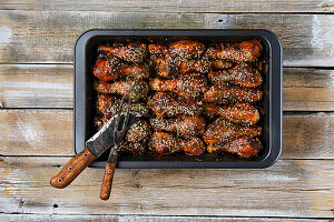 Roasted chicken thighs with sesame seeds and spicy sauce