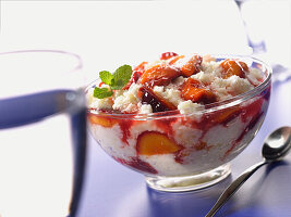 Bowl with coconut rice and plum pieces