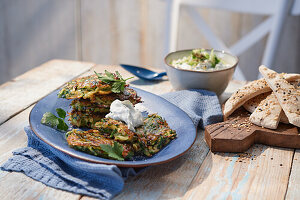 Courgette fritters with cucumber and garlic dip