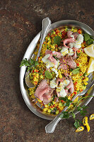 Roast beef on couscous salad with yoghurt sauce