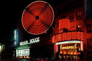 Cabaret in neon lights at night in Paris; Paris, France