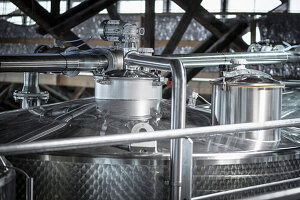 Shiny stainless steel winemaking tank