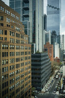 Aerial view of modern buildings by street in city