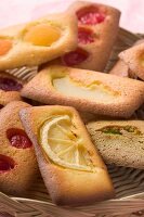 Various Financiers (French almond sponge cakes) with fruit