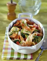 Chicken breasts with crushed tomatoes and broccolis