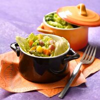 Small casserole dish of green cabbage and old-fashioned vegetables