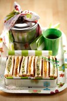 Assorted white bread sandwiches in a lunch box (vegetarian)