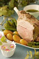 Shoulder of lamb cooked with herbs in a cloth