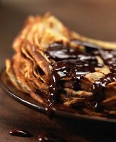 Pile of crepes with melted chocolate