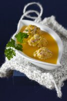 Butternut squash soup with green olive meatballs
